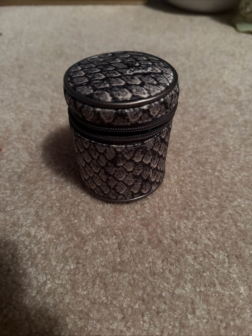 NWT Coach world travel adapter features a distinctive snakeskin-inspired print